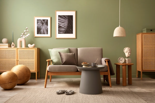 stylish-living-room-interior-composition-modern-scandi-sofa-mock-up-frames-wooden-commode-creative-personal-accessories-eucalyptus-green-wall-template-copy-space